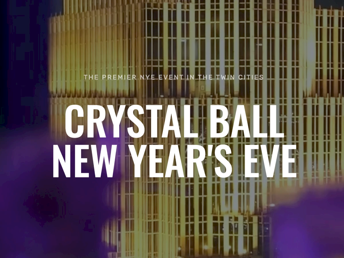 A neon-lit city backdrop advertises &ldquo;Crystal Ball New Year&rsquo;s Eve,&rdquo; promising a premier event in the urban skyline tonight.